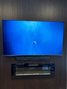 TV and sound bar mounting above a fireplace on wooden platform, Milpitas, 9/18/2023
