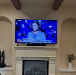 TV mounting and on-wall cable concealment above a fireplace, Atherton, 9/11/2021